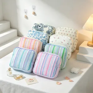 Portable seersucker storage pouch collection in various striped and floral patterns