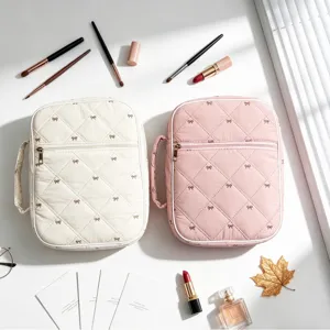 Bolsa de almacenamiento acolchada con lazo para libros y cosméticos, crema y rosa.