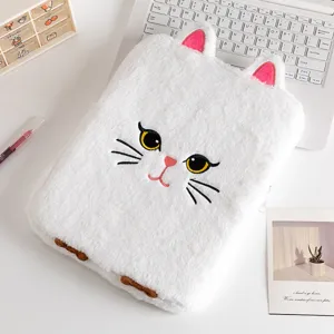 Close-up detail of the white plush cartoon cat iPad sleeve with intricate embroidery