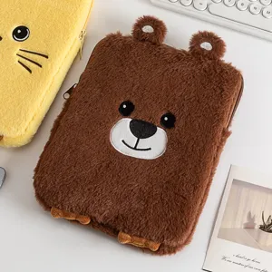 Macro detail showing a cute plush bear and cat tablet sleeve with embroidery design