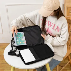 Internal storage compartments of black iPad messenger bag for 11-13.3 inch tablets