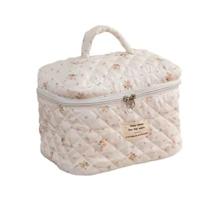 Cute floral quilted cotton makeup bag with top handle for travel toiletry storage