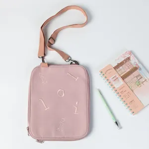 Pink padded crossbody iPad sleeve and tablet protective bag with adjustable strap