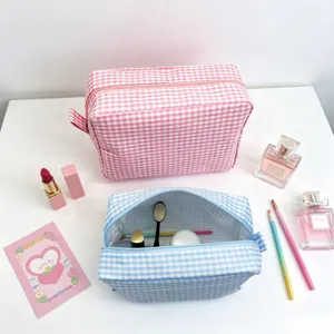Large seersucker checkered cosmetic bag in pink and blue for travel and daily storage