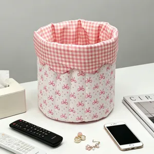 Small pink bow quilted fabric storage basket with checkered lining for desktop organization