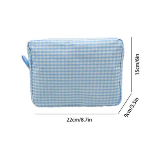 Blue gingham seersucker makeup bag showing dimensions 22cm by 15cm by 9cm clearly