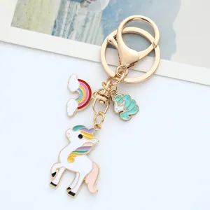 Close-up of a cute alloy enamel unicorn keychain featuring rainbow and pony charms