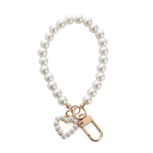 Elegant heart-shaped pearl keychain with gold clasp for women bag charm accessory