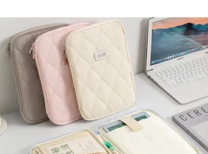 Quilted tablet sleeve for 11-inch iPad shown in multiple colors and internal layout