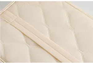 Close-up detail of the diamond quilted material on this minimalist tablet sleeve.