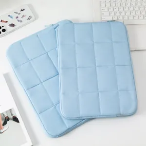 Minimalist light blue quilted 14 inch laptop sleeve with protective padded design