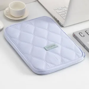 Portable lavender quilted tablet sleeve with zipper closure and protective padding liner
