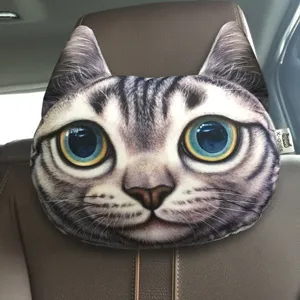 Detail of a 3D realistic cat face car headrest pillow installed on a leather seat