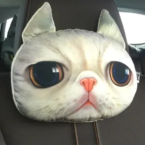 Close-up of 3D lifelike cat face car neck pillow headrest on a brown leather car seat