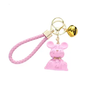 Cute pink resin bear keychain with woven strap and embossed lucky letter pattern