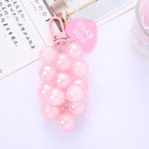 A cute pink faux grape bead keychain charm with heart tag for bags and car key accessories