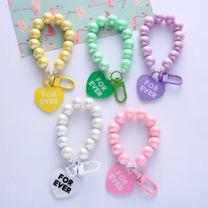 Colorful UV-plated beaded keychains with heart FOR EVER charms in five vibrant colors
