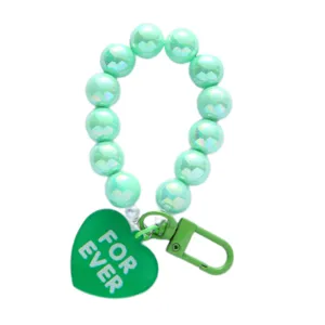 Mint green iridescent acrylic beaded keychain featuring a heart charm and lobster clasp
