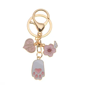Cute pink cat paw and cherry blossom keychain with heart charm