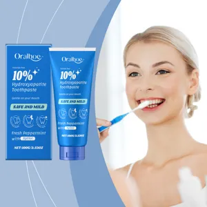 Vue détaillée du tube de dentifrice à la menthe et hydroxyapatite à 10% et de sa boîte.