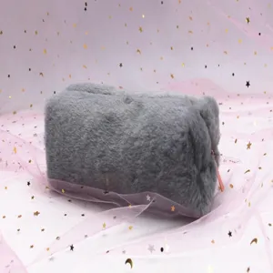 Detailed view of soft grey plush octagonal pencil case with cute pink ribbon decoration