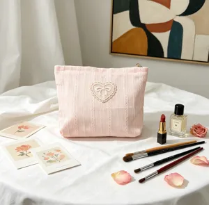 Delicate pink corduroy makeup bag with heart lace and bow applique detail, large