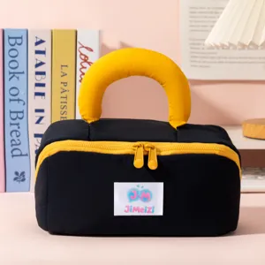 Close-up detail of a portable black and yellow marshmallow pillow handle makeup organizer bag