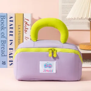 Macro detail of the soft marshmallow purple cosmetic bag with puffy lime green handle