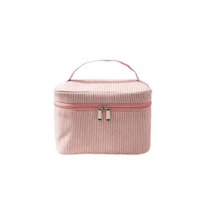 Grande trousse de maquillage rayée en seersucker avec poignée et double fermeture éclair