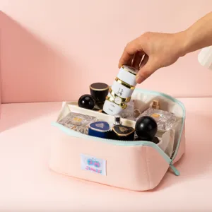 Close-up of a pink portable pillow makeup bag showing internal storage for perfumes