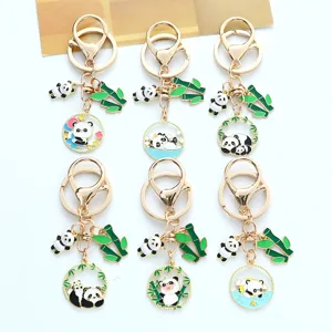 Detailed view of six cute metal panda keychains with green bamboo leaf charms for bags