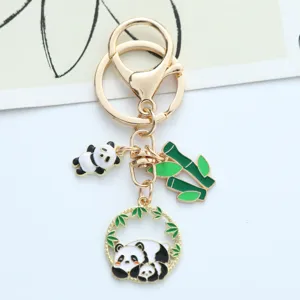 Detailed view of handmade panda keychain with bamboo and panda charms for bags