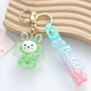 Close-up of green acrylic liquid sand rabbit keychain with gradient Bubble strap detail