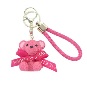 Cute pink resin woven bear keychain with gold ring and LOVE IS ETERNAL ribbon charm