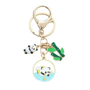 Cute enamel panda keychain featuring bamboo charms and golden metal rings for bags.
