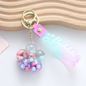 Detail view of the colorful oil-filled quicksand flower keychain with Bubble strap