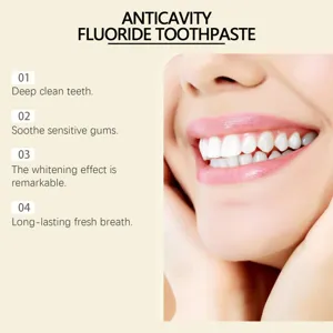 Detail view of teeth whitening and anticavity fluoride toothpaste highlighting clean teeth effects.