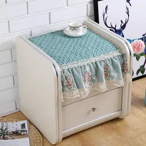 Quilted bedside table dust cover with elegant lace trim and floral embroidery for home decor detail