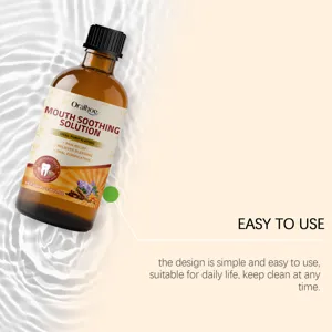 Close-up of herbal mouth soothing solution in brown bottle, clear liquid for daily oral care.