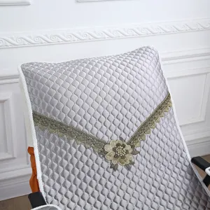 Quilted rocking chair cushion detail view, grey floral lace embroidered recliner mat.