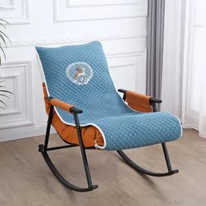 Detail view of the rocking chair cushion featuring blue quilted fabric and cute deer embroidery.