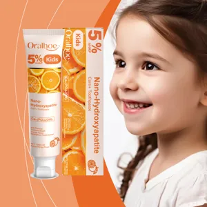 Vue détaillée du dentifrice pour enfants Oralhoe à l'orange avec une capacité de 114g.