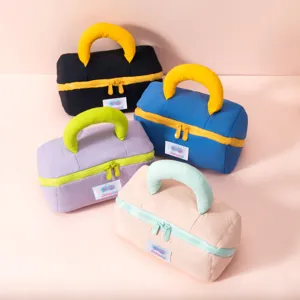 Padded marshmallow pillow cosmetic bags in various vibrant colors for travel storage