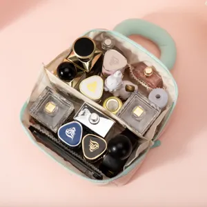 Portable quilted marshmallow makeup bag with large circular handle for travel cosmetic storage