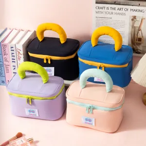 Four colorful waterproof travel cosmetic storage bags with comfortable padded handles