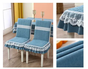 Detail macro view of blue quilted chair cover featuring elegant white floral lace trim