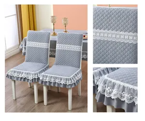 Close-up detail of quilted chair cover with elegant white floral lace trim and grey fabric