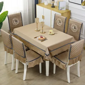 Luxury champagne gold tablecloth with matching quilted chair cover set in elegant dining room