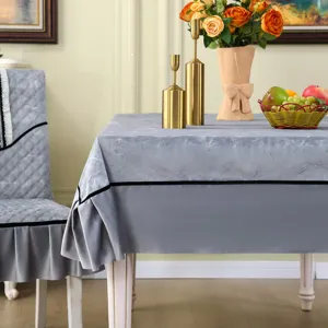 Grey textured tablecloth and matching quilted chair cover set for elegant dining room decor