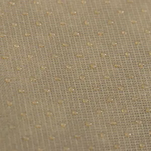 Détail macro de points de silicone antidérapants sur base de coussin tan